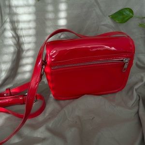 Red vinyl shoulder purse